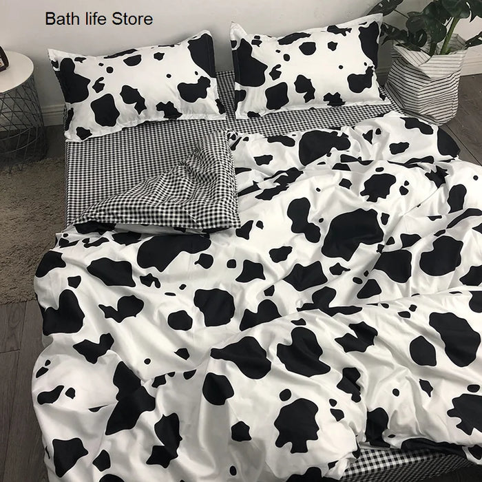 Parure de lit vache noir et blanc sur un lit king size