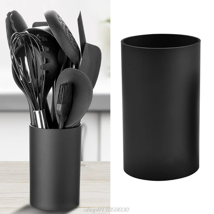 Porte-ustensiles cuisine cylindre noir sur comptoir moderne