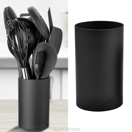 Porte-ustensiles cuisine cylindre noir sur comptoir moderne