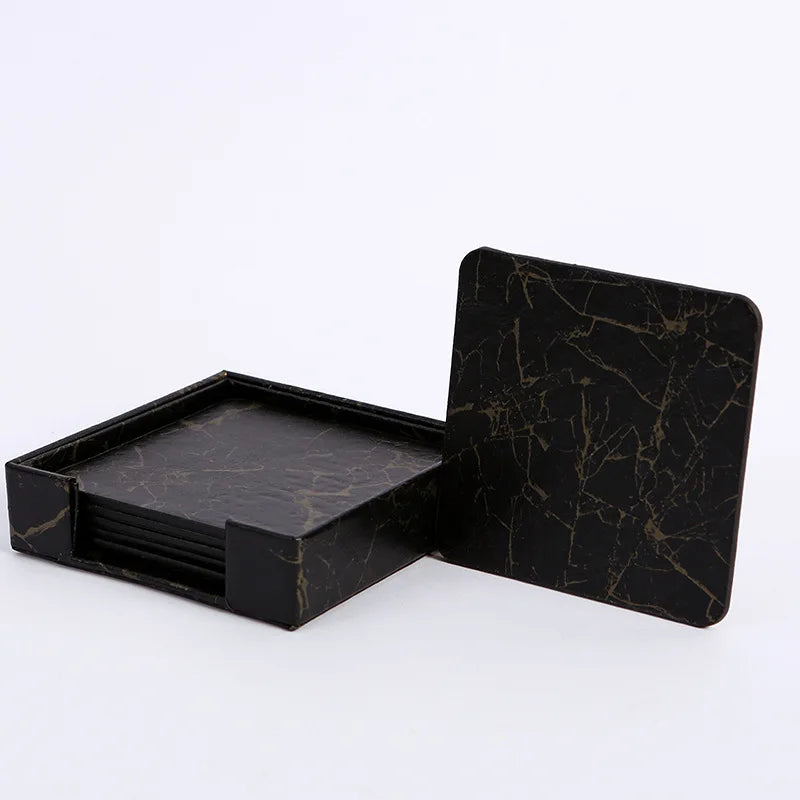 Un ensemble de sous-verres en marbre noir, avec un design élégant et une finition luxueuse.