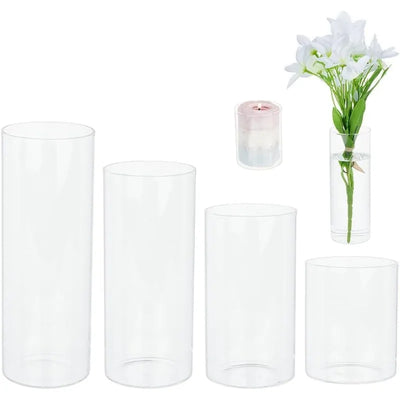 Lot de 4 vases cylindriques en verre transparent sur table