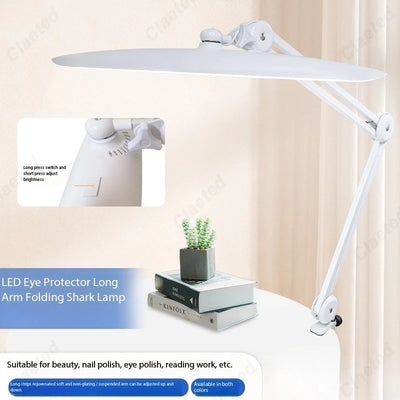 Lampe de chevet pince LED pliante en noir sur table de bureau