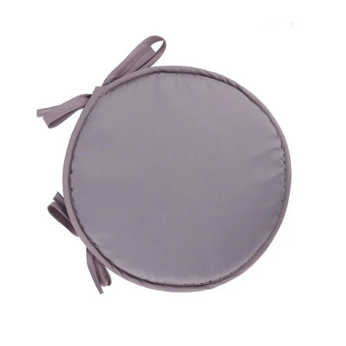 Coussin de chaise rond en éponge couleur beige sur une chaise en bois