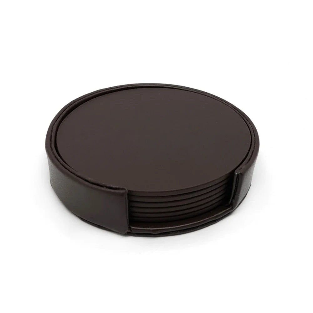 Ensemble de sous-verres noirs ronds en cuir avec un design élégant et moderne.