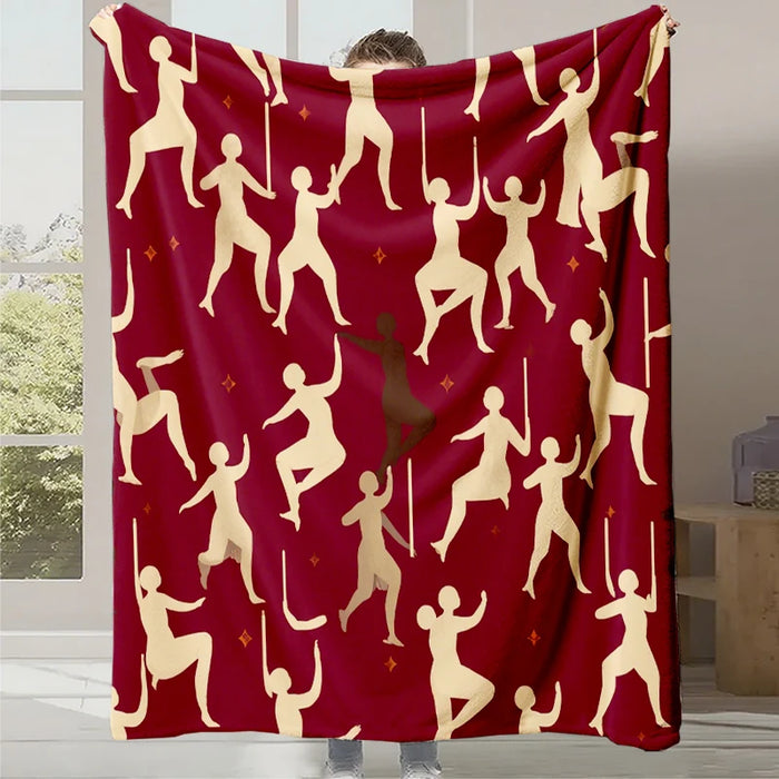 Ce plaid rouge vif est orné de silhouettes aux mouvements dynamiques, créant une impression de célébration et de joie.