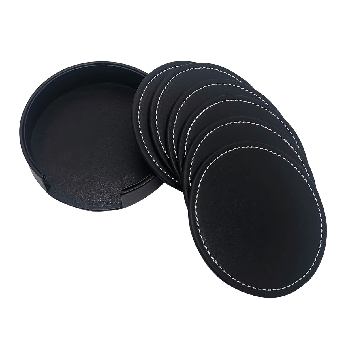 Coasters en cuir noir avec coutures apparentes, rangés dans un boîtier rond.