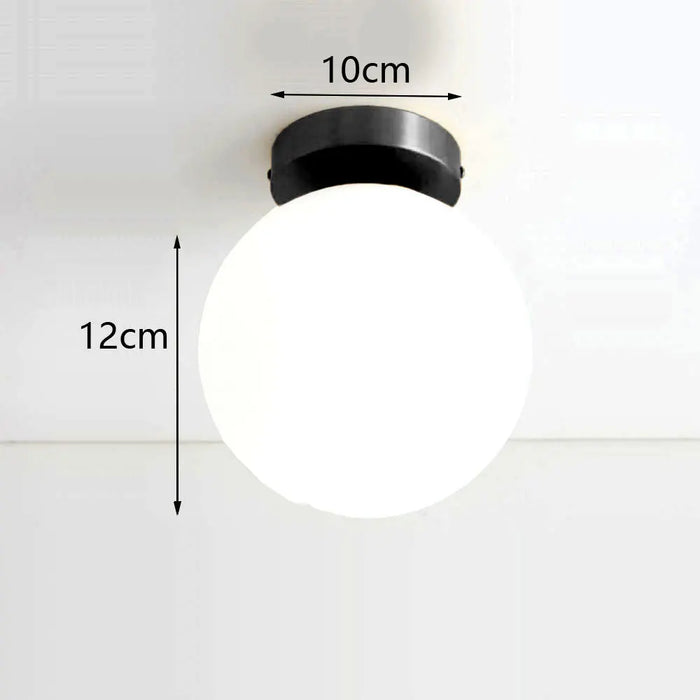 lampe suspension moderne or blanc sphères translucides structure métallique minimaliste