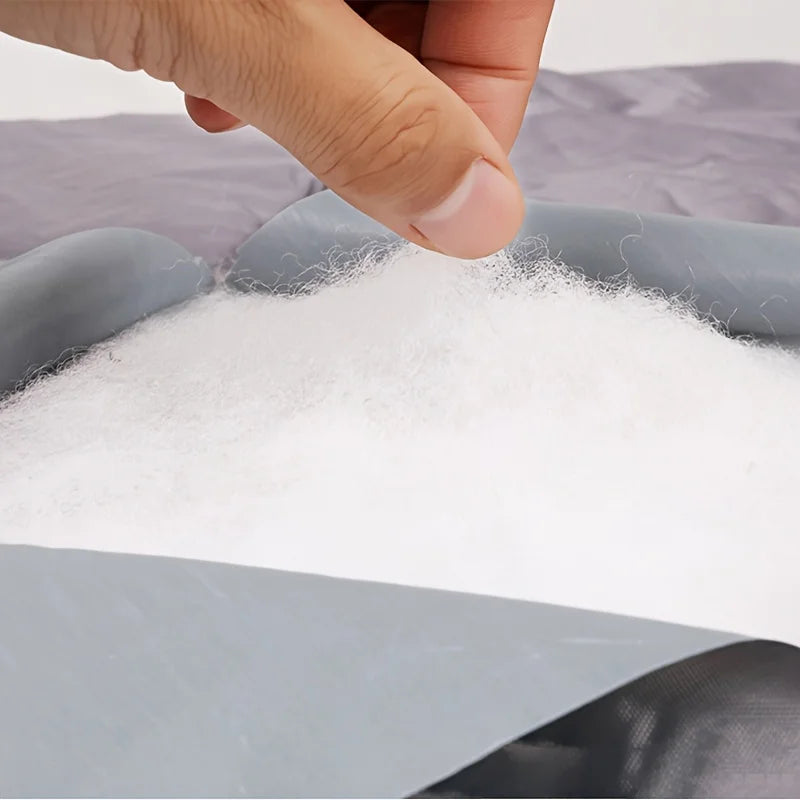 Vue détaillée du garnissage thermique en fibres du rideau isolant pour porte