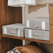 boîtes rangement pliables grises draps housses couettes organisation literie transparentes minimaliste