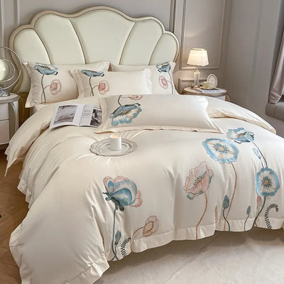 Housse de couette beige 220x240 avec broderie chic sur lit