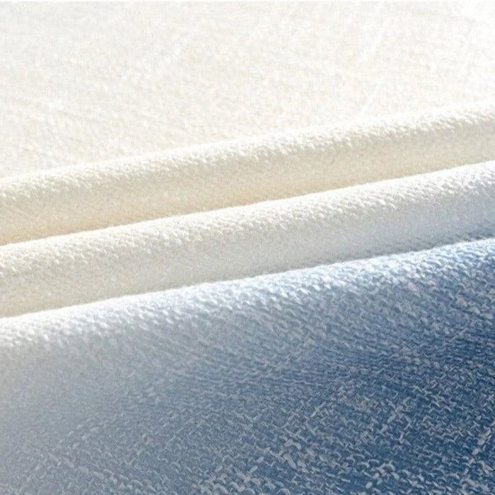 Image de tissu en bleu et blanc, idéal pour la confection de vêtements ou de décorations intérieures, offrant un aspect élégant et moderne pour diverses applications.
