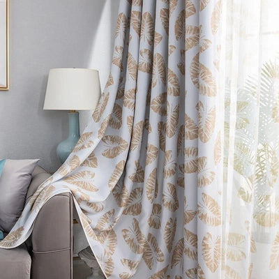 Rideau élégant à motifs de feuilles, offrant une touche naturelle et apaisante à votre salon. Idéal pour créer une ambiance chaleureuse et accueillante avec un motif tropical parfait pour n'importe quel intérieur moderne. Transformez votre espace avec ce rideau tendance qui équilibre luminosité et intimité. Accessoire de décoration intérieure incontournable pour un style raffiné.