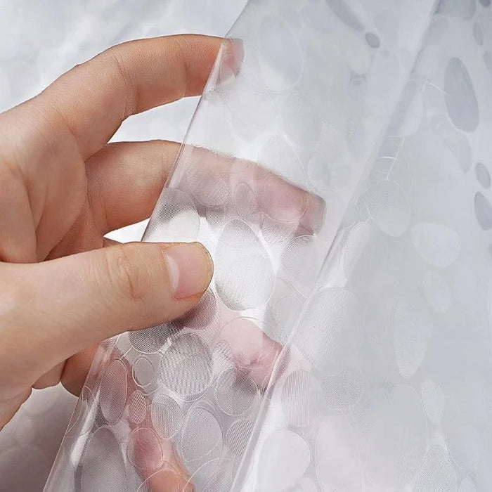 Film adhésif décoratif transparent avec motifs circulaires, idéal pour la personnalisation de fenêtres et la protection de surfaces, facile à appliquer et à retirer.