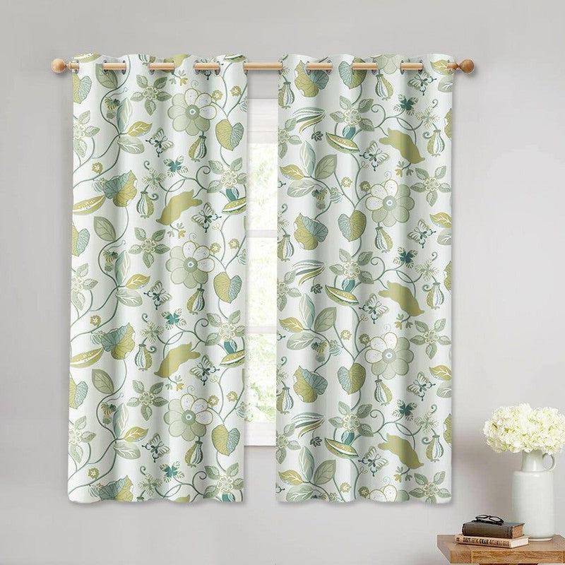 Rideaux à motifs floraux verts et bleus pour salon, apportant une touche de fraîcheur et de nature à la décoration intérieure. Parfaits pour ajouter de l'élégance et de la luminosité à vos fenêtres, ces rideaux modernes transforment l'ambiance de votre pièce.