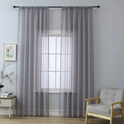 rideau gris moderne motif géométrique texturé translucide pompons blanc tringle noire