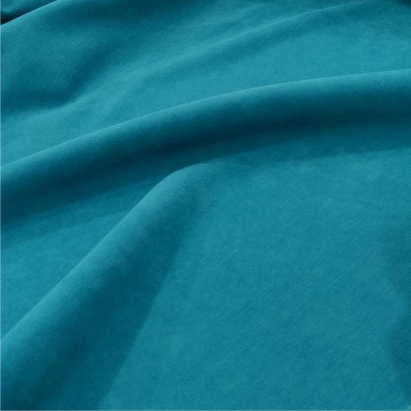 Texture de tissu bleu-vert, idéal pour la décoration intérieure ou la confection de vêtements. Profondeur de couleur élégante, parfaite pour ajouter une touche de sophistication à tout espace ou tenue.