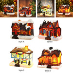 Détail de la maison de village de Noël illuminée la nuit
