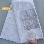 tissu dentelle brodée fleurs paillettes couleurs bleu vert rose occasion mariage party