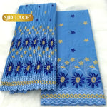 tissu dentelle traditionnelle fleurs roses jaunes vert foncé rouge bleu clair mariage occasion formelle
