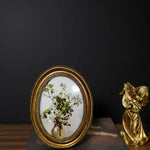 cadre photo ovale orné motif floral peint vintage décoratif decoration ornemental