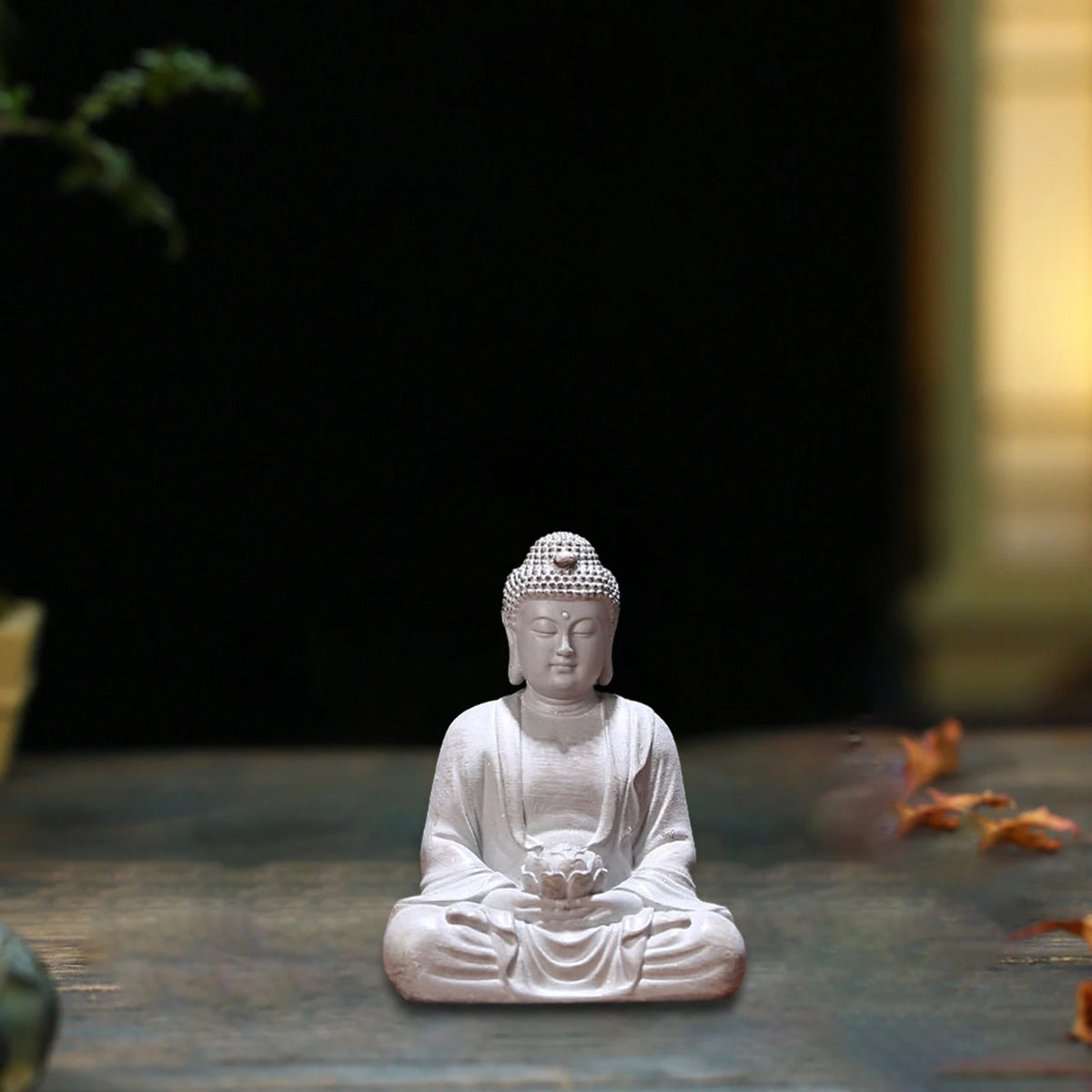 statue bouddha zen blanc gris bois décoratif assiette cigarettes tapis fibres naturellements éléments divers