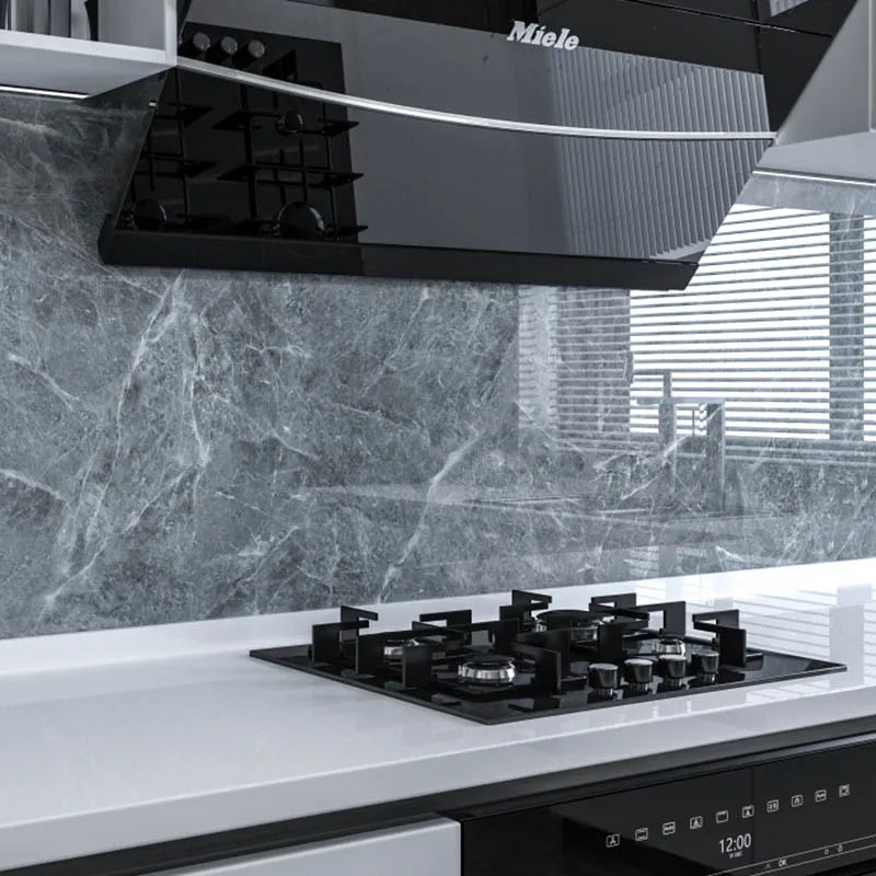 plaque cuisson noire marbrée moderne boutons commande cuisine plan travail