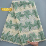 tissu dentelle brodée fleurs paillettes couleurs bleu vert rose occasion mariage party