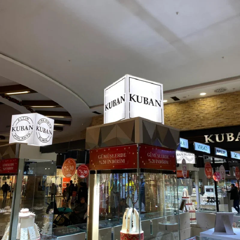 Cube lumineux LED blanc posé sur une étagère