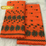 tissu dentelle traditionnelle fleurs roses jaunes vert foncé rouge bleu clair mariage occasion formelle