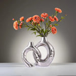 vases céramique modernes minimalistes abstraits ouvertures circulaires couleurs neutres sculptural