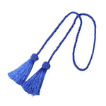 Embrasse rideau en bleu électrique avec deux pompons tressés, pour dynamiser votre décoration intérieure avec couleur.