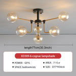 lampe suspension moderne sphères translucides structure dorée salon blanc nordique
