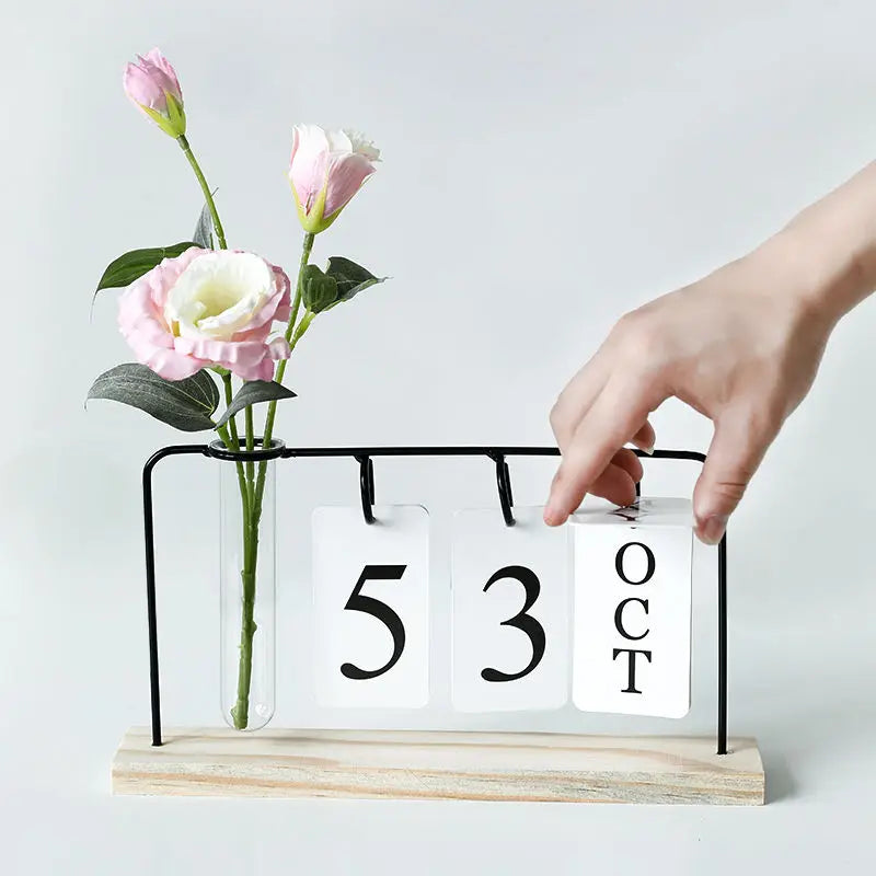 calendrier mural moderne minimaliste noir blanc vase transparent plantes cartes dates support métallique bois