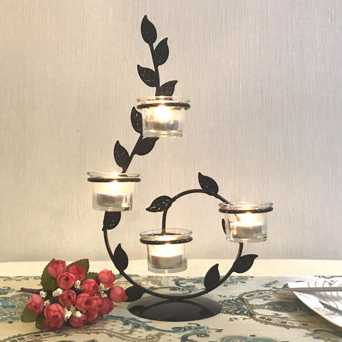 support bougies feuilles stylisées noir verre transparent plantes succulentes bougies allumées pots verre rusticité