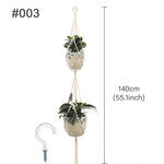 plante suspendue macramé décoratives boho artisanale pot fleur blanc anneaux métalliques decoration murale cour