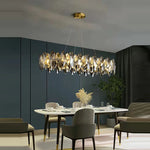 Suspension lumineuse contemporaine transparente dorée cristaux géométriques chambre salon