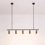 suspension lumineuse moderne noir doré tête brillante métal poli minimaliste