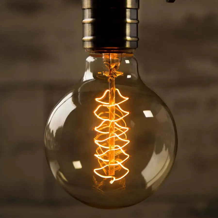 ampoules filament transparentes spirales dorées vintage rétro salon tringles câbles noirs