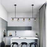 suspension lumineuse moderne noir doré tête brillante métal poli minimaliste