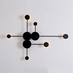 lampes murales modernes abstrait cercles tiges métalliques noir doré minimaliste têtes