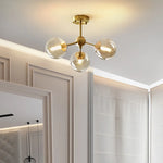 lustre moderne lumières doré sphères transparentes art déco contemporain led chambre salon