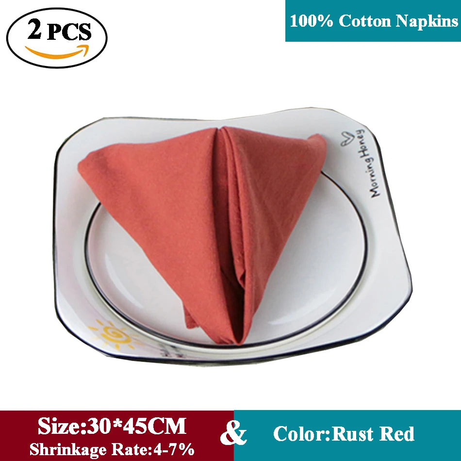 Deux serviettes en coton 100% de couleur rouge rouille, de taille 30 x 45 cm, avec un rétrécissement de 4 à 7%.