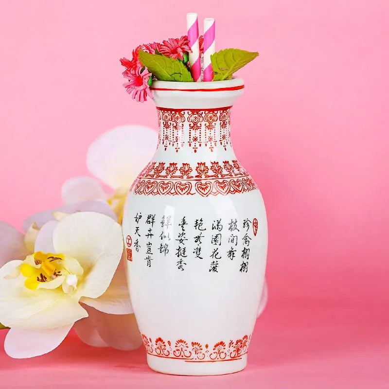 vase décoratif céramique fleurs oiseaux motifs géométriques blanc rouge vert rose traditionnel