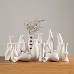 vases blancs modernes minimalistes céramique opaques fleurs artificielles table simple