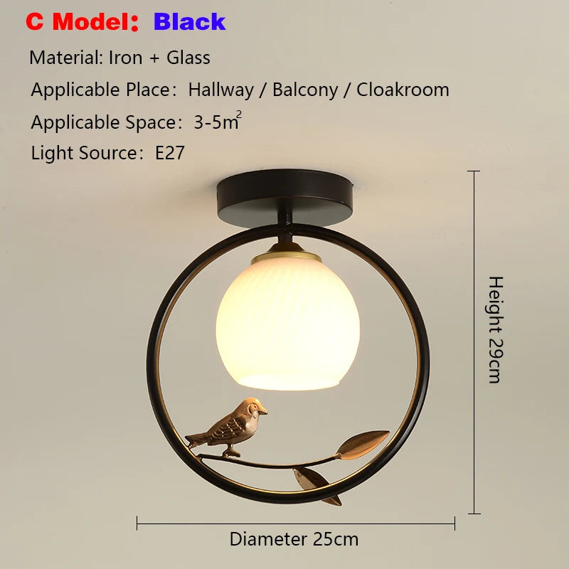 lampe moderne or noir oiseaux dorés branches sphère blanche translucide led echangement facile