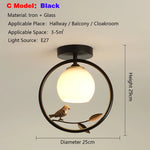 lampe moderne or noir oiseaux dorés branches sphère blanche translucide led echangement facile
