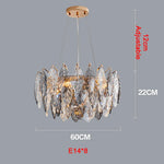 chandelier moderne luxueux transparent feuilles stylisées câbles métalliques doré argenté