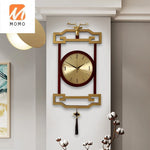 horloge murale bois chinois cadres dorés marron motif géométrique aiguilles dorées classique