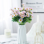 bouquet marguerites soie orange jaune rose blanc vase blanc moderne décoration intérieur mariage