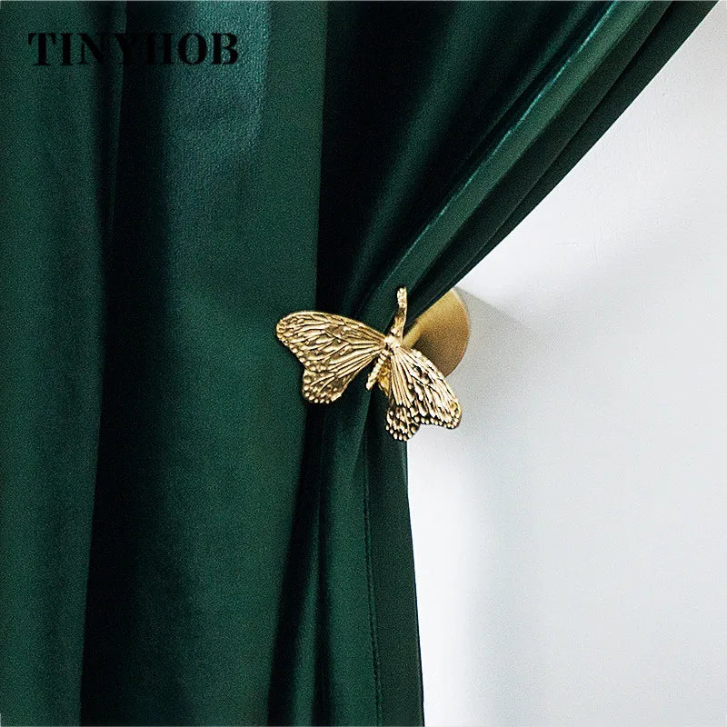 pince rideau dorée insectes anges détails sculptés quincaillerie fenêtre vintage opaques